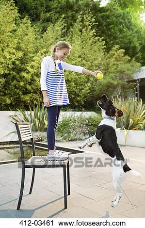Girl playing with dog outdoors View Large Photo Image Stock Image - Girl playing with dog outdoors. Fotosearch