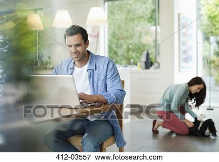 Man using laptop in kitchen View Large Photo Image Stock Photo - Man using laptop in kitchen. Fotosearch