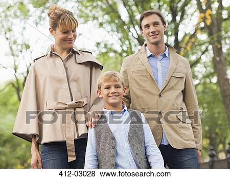 Stock Photo - Family walking in park. Fotosearch