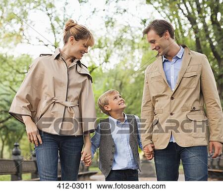 Family walking together in park View Large Photo Image Stock Image - Family walking together in park. Fotosearch