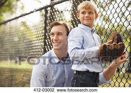 Father and son in baseball field View Large Photo Image Stock Image - Father and son in baseball field. Fotosearch