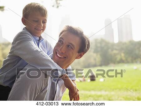 Father and son in urban park View Large Photo Image Stock Image - Father and son in urban park. Fotosearch