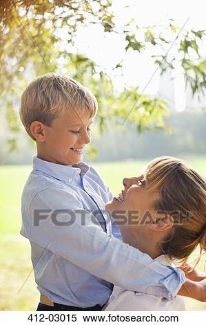 Father and son in urban park View Large Photo Image Stock Photography - Father and son in urban park. Fotosearch