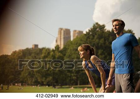 Stock Photo - Couple resting in urban park. Fotosearch