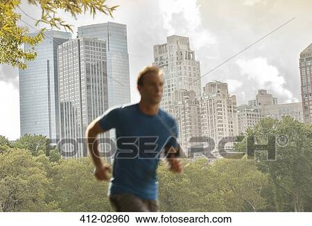 Man running in urban park View Large Photo Image Stock Image - Man running in urban park. Fotosearch
