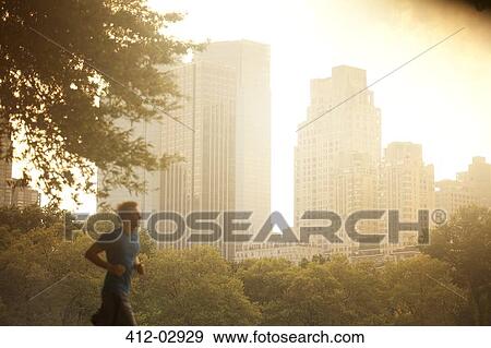 Man running in urban park View Large Photo Image Stock Photo - Man running in urban park. Fotosearch