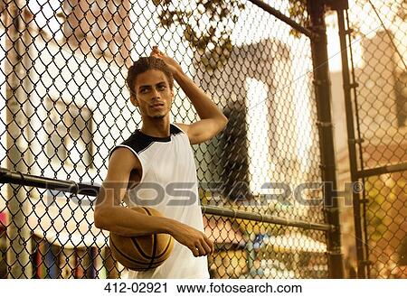 Man standing on basketball court View Large Photo Image Stock Image - Man standing on basketball court. Fotosearch