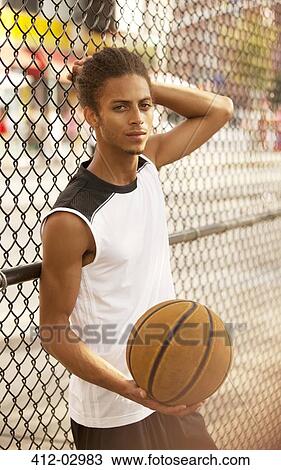 Man standing on basketball court View Large Photo Image Stock Image - Man standing on basketball court. Fotosearch