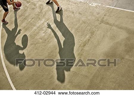 Men playing basketball on court View Large Photo Image Picture - Men playing basketball on court. Fotosearch