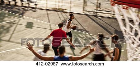 Men playing basketball on court View Large Photo Image Stock Photo - Men playing basketball on court. Fotosearch