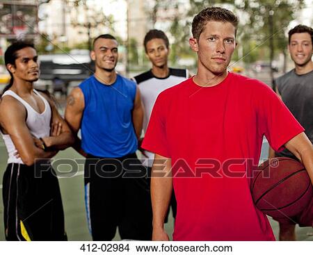 Men standing on basketball court View Large Photo Image Picture - Men standing on basketball court. Fotosearch