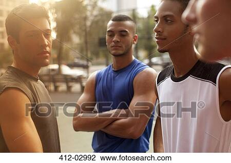 Men standing on basketball court View Large Photo Image Stock Image - Men standing on basketball court. Fotosearch