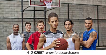 Men standing on basketball court View Large Photo Image Stock Photo - Men standing on basketball court. Fotosearch