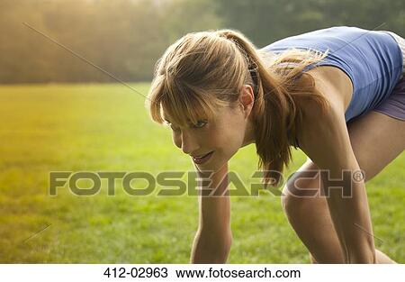 Runner in stance at park View Large Photo Image Stock Image - Runner in stance at park. Fotosearch