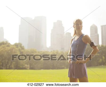 Runner standing in urban park View Large Photo Image Stock Photo - Runner standing in urban park. Fotosearch