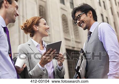Business people talking on city street View Large Photo Image Picture - Business people talking on city street. Fotosearch