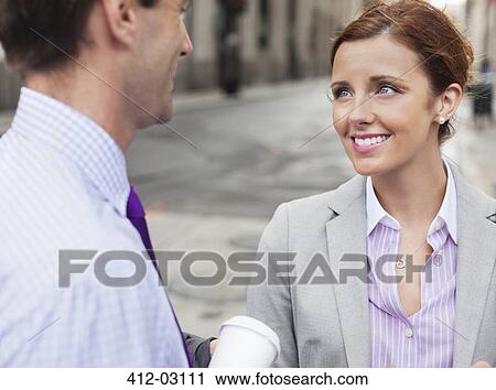 Business people talking on city street View Large Photo Image Stock Image - Business people talking on city street. Fotosearch