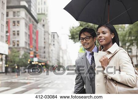 Picture - Business people walking on city street. Fotosearch