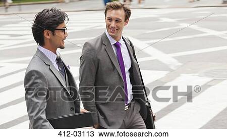 Businessmen talking on city street View Large Photo Image Stock Image - Businessmen talking on city street. Fotosearch