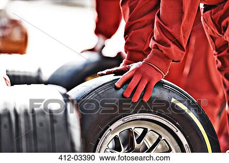 Mechanic working at pit stop View Large Photo Image Stock Image - Mechanic working at pit stop. Fotosearch