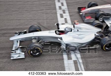 Race car crossing finish line on track View Large Photo Image Stock Image - Race car crossing finish line on track. Fotosearch