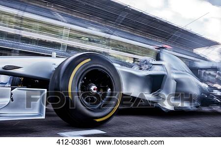 Race car driving on track View Large Photo Image Stock Image - Race car driving on track. Fotosearch