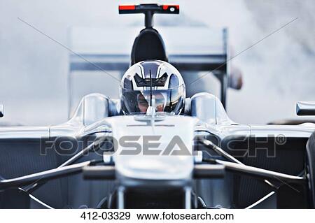 Race car driving on track View Large Photo Image Stock Photo - Race car driving on track. Fotosearch