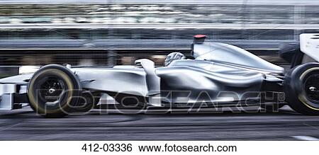 Race car driving on track View Large Photo Image Stock Photograph - Race car driving on track. Fotosearch