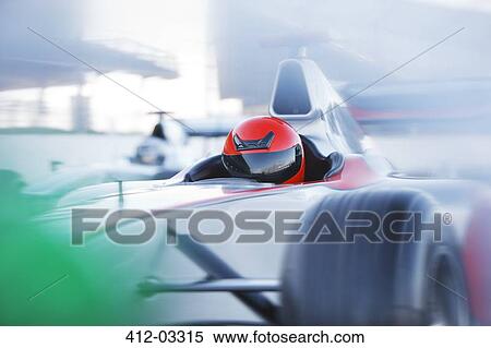 Race car driving on track View Large Photo Image Stock Photography - Race car driving on track. Fotosearch
