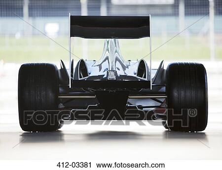 Stock Image - Race car sitting in garage. Fotosearch
