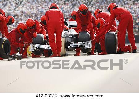 Race car team working at pit stop View Large Photo Image Stock Image - Race car team working at pit stop. Fotosearch