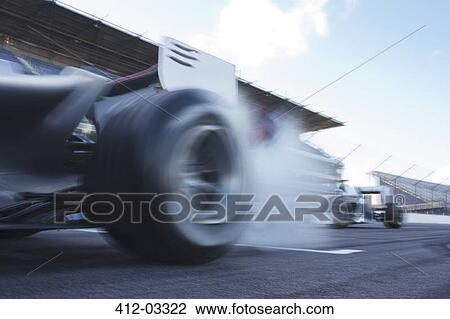 Race cars driving on track View Large Photo Image Stock Image - Race cars driving on track. Fotosearch