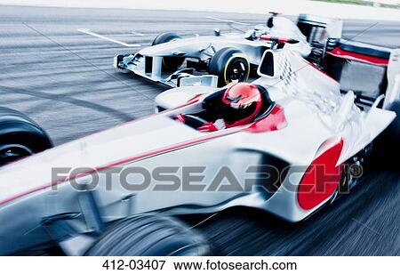Race cars driving on track View Large Photo Image Stock Photo - Race cars driving on track. Fotosearch
