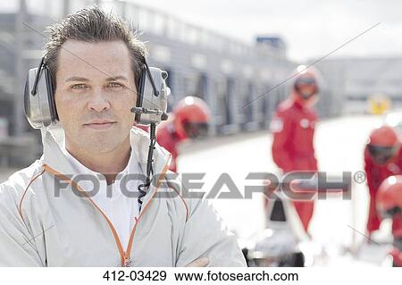 Race manager wearing headphones on track View Large Photo Image Stock Photo - Race manager wearing headphones on track. Fotosearch