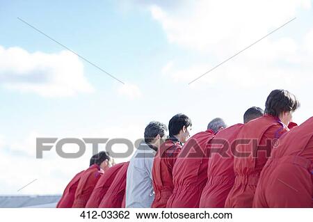 Race team watching on sidelines View Large Photo Image Stock Image - Race team watching on sidelines. Fotosearch