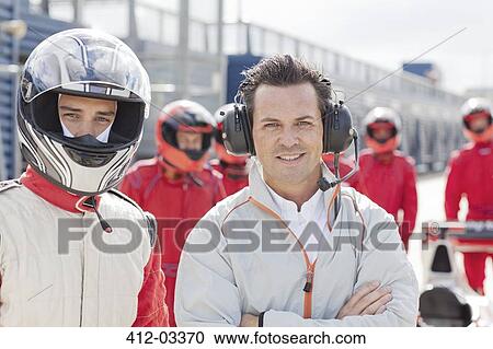 Racer and manager standing on track View Large Photo Image Stock Image - Racer and manager standing on track. Fotosearch
