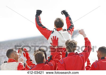Racer and team cheering on track View Large Photo Image Stock Image - Racer and team cheering on track. Fotosearch