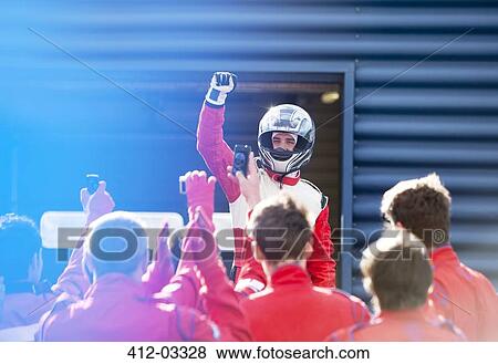 Racer and team cheering on track View Large Photo Image Stock Photo - Racer and team cheering on track. Fotosearch