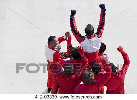 Racer and team cheering on track View Large Photo Image Stock Photo - Racer and team cheering on track. Fotosearch