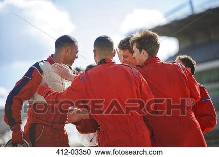 Racer and team talking on track View Large Photo Image Stock Image - Racer and team talking on track. Fotosearch