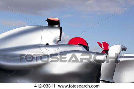 Racer giving thumbs up in car View Large Photo Image Stock Image - Racer giving thumbs up in car. Fotosearch