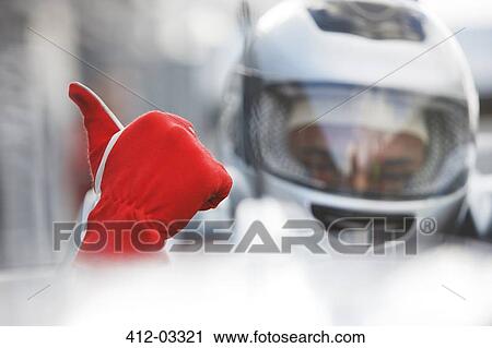 Racer giving thumbs up in car View Large Photo Image Stock Image - Racer giving thumbs up in car. Fotosearch