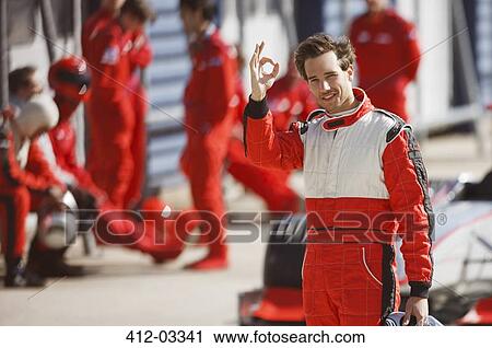 Racer making 'OK' sign on track View Large Photo Image Stock Image - Racer making 'OK' sign on track. Fotosearch