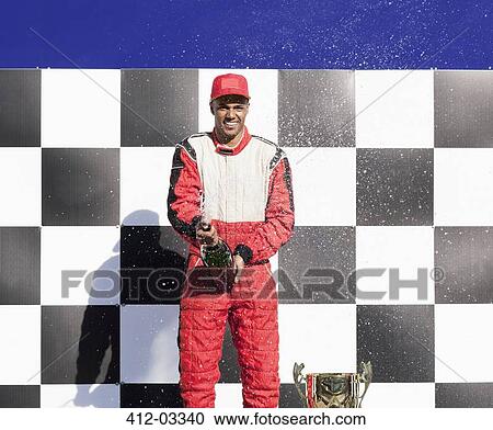 Racer opening champagne at award ceremony View Large Photo Image Stock Image - Racer opening champagne at award ceremony. Fotosearch