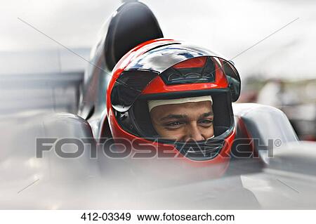 Stock Photo - Racer sitting in car on track. Fotosearch