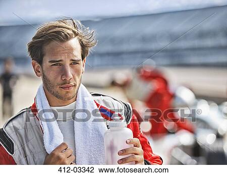 Racer with towel on track View Large Photo Image Stock Image - Racer with towel on track. Fotosearch