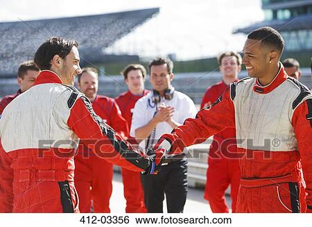 Racers shaking hands on track View Large Photo Image Stock Photograph - Racers shaking hands on track. Fotosearch