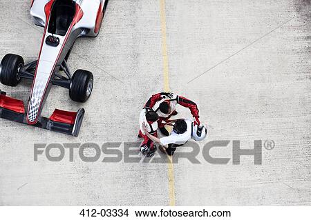 Racing team hugging on track View Large Photo Image Picture - Racing team hugging on track. Fotosearch