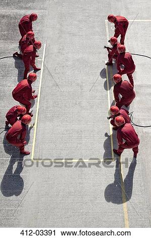 Racing team ready at pit stop View Large Photo Image Stock Image - Racing team ready at pit stop. Fotosearch