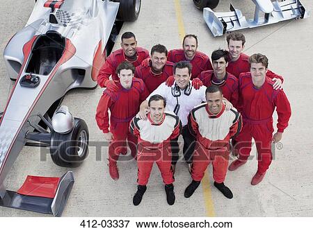 Racing team smiling at pit stop View Large Photo Image Stock Photo - Racing team smiling at pit stop. Fotosearch